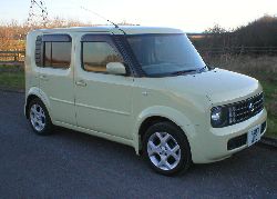 Nissan Cubic Yellow Cube in the countryside